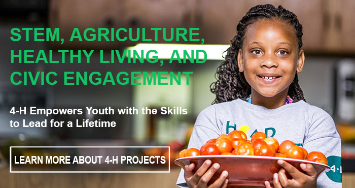 Girl with plate of tomatoes