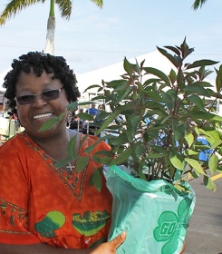 Event attendee holding free native plant