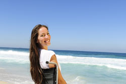 woman in wheelchair on the beach
