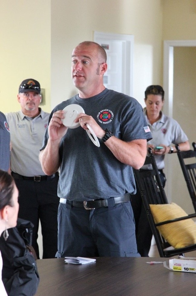 Man holding Smoke Alarm