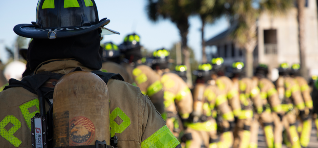 Image of firefighters marching in a line